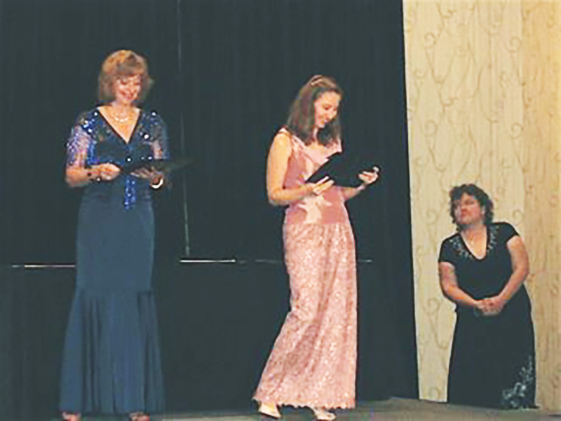 Author Jennifer Hudson Taylor receiving Genesis Award at ACFW Conference
