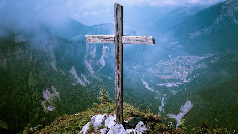 Wooden cross in the mountains