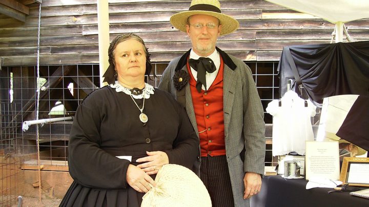 Man and woman wearing Victorian mourning clothing