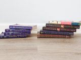 stack of thin books on left and thick books on right